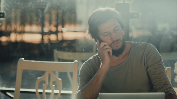 Bearded Freelancer Man Gets Bad News on the Phone and in Depression