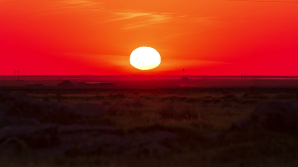 Vivid Sunset and Solar Flare with Passing Over Pasture