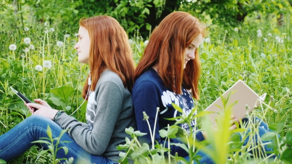 Two Sisters Twins Rest in the Park