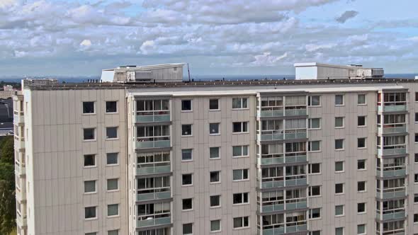 Flying over apartment building and revealing downtown and seascape of Malmo