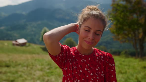 Attractive Woman Looking Camera on Green Meadow