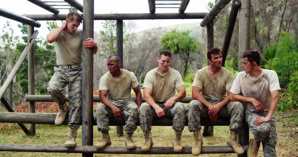 Military troops relaxing during obstacle course 