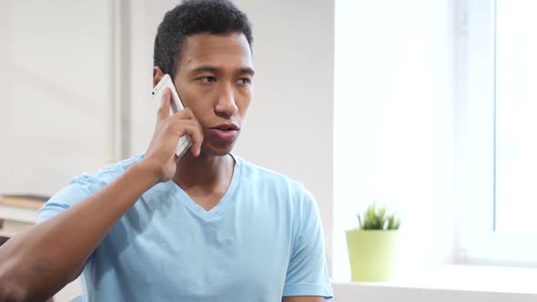 Black Man Talking on Phone