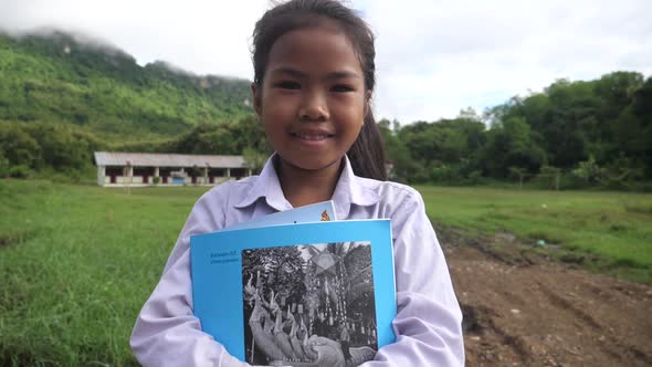 Rural Girl Hug Book And Smiling alt