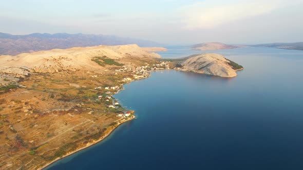 Flying above apartments for tourists on the island of Pag on Dalmatian coast