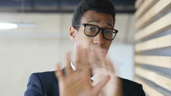 Black Man in Suit Denying Offer, Gesture of Rejection