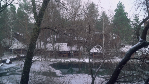 Snowfall on the Lake in the Ukrainian Village