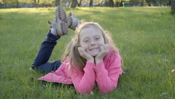 Girl Is Lying on the Grass and Smiling