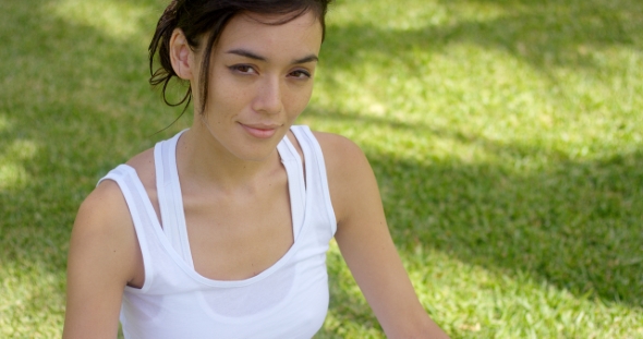 Beautiful Young Woman in White Shirt with Grin