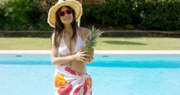 Woman in Straw Hat and Colorful Wrap Skirt