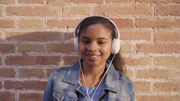 African American woman with headphones listening to music,