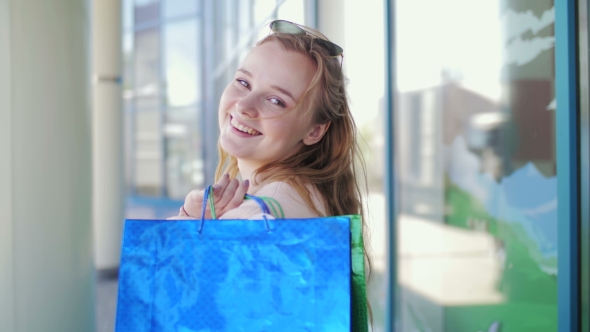 Portrait of a Beautiful Girl Who Left the Store with Shopping