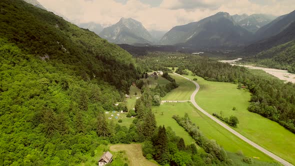 Aerial view of a valley and the main street surrounded by hills in Slovenia.