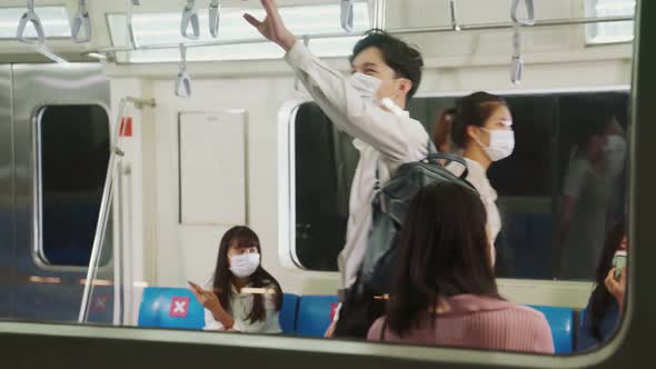 Crowd of People Wearing Face Mask on a Crowded Public Subway Train Travel