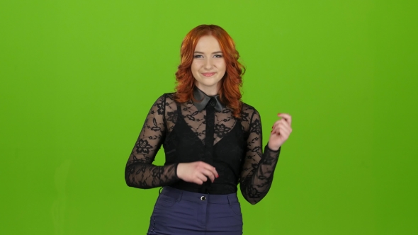 Redhaired Girl Begins To Dance, She Is in a Good Mood. Green Screen