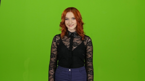 Girl Is an Hourhand, Showing a Thumbs Up and Smiling. Green Screen