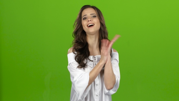 Girl Stands and Applauds a Good Performance, She Is Happy. Green Screen