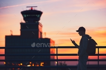 e airport. Air Traffic Control Tower at the amazing sunset. Prague, Czech Republic.