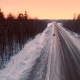 Intercity Highway Among Woodland at Sunset in Winter - VideoHive Item for Sale