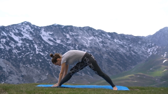 Woman Practicing Yoga Outdoors