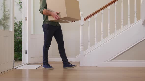 Caucasian attractive man moving into new house