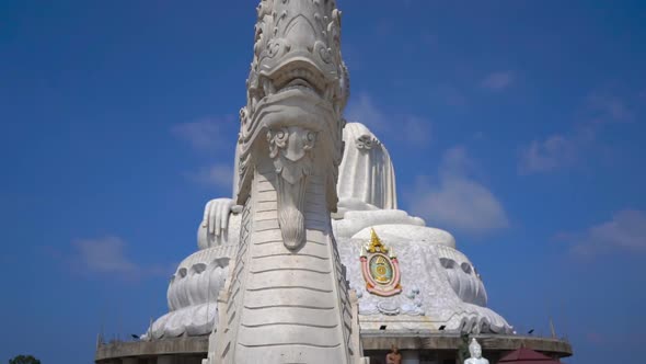 Slowmotion Steadicam Shot of a Big Buddha Statue on Phuket Island. Travel To Thailand Concept