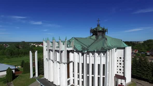 Church in Small City Among Pastures. Drone Footage.