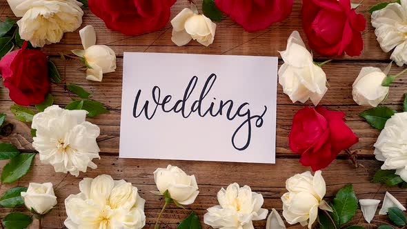 WEDDING card on a wooden table top view zoom in