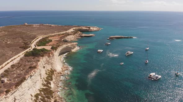 Aerial drone video from eastern Malta, Marsaxlokk area, Il-Hofra l-Kbira bay.