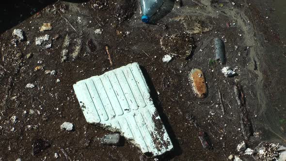 Water Pollution With Dirt And Plastic Garbage Floating On The Surface Of The Sea