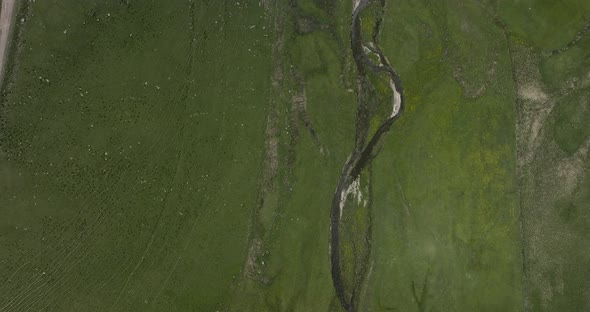 Top View Of Vast Pasture Land With Flowing River At Ktsia-Tabatskuri Managed Reserve In Samtskhe-Jav