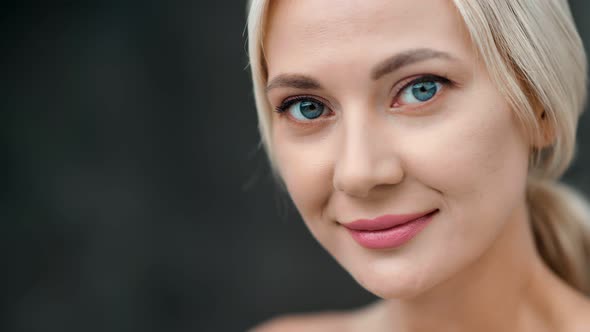 Closeup Face of Adorable Smiling Girl with Blue Eyes and Clean Skin Posing Isolated Choker Shot