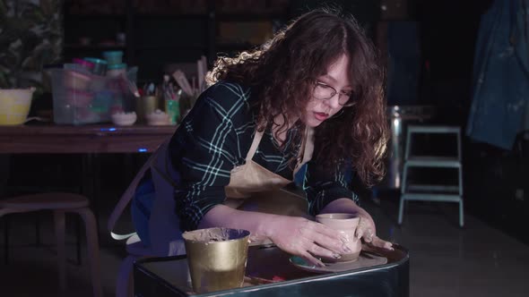 Pottery Crafting in the Art Studio  Woman Forming a Simple Pot Out of Wet Clay