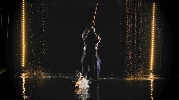 A Japanese Kendo Fighter Wearing Armor and Traditional Kimono Practices a Martial Art with a Bamboo