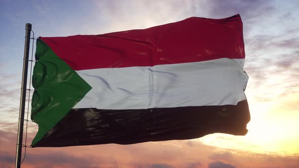 Flag of Sudan Waving in the Wind Against Deep Beautiful Sky at Sunset