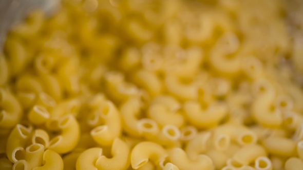 Dry Italian Pasta Pouring in a Heap