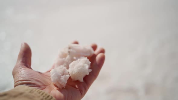 Mans Hand Holding Crystallized Salt Natural Mineral Formation