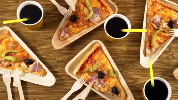 Slices of Pizza on Wooden Plates. Party Concept.