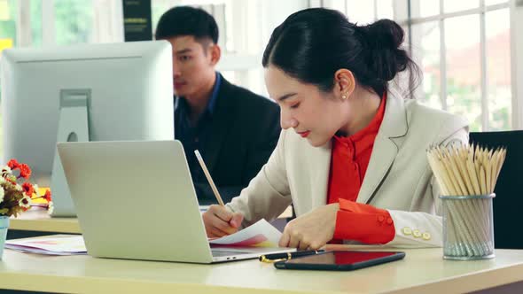 Business People Working at Table in Modern Office