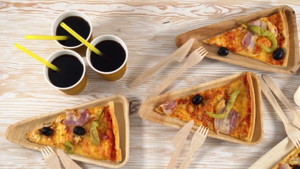 Slices of Pizza on Wooden Plates. Party Concept.