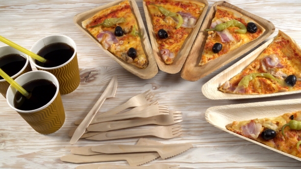 Slices of Pizza on Wooden Plates. Party Concept.