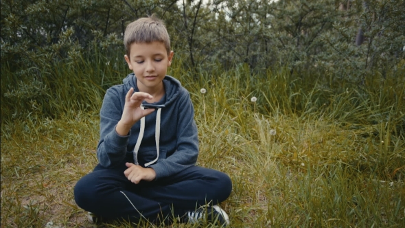 Boy Plays with Fidget Spinner