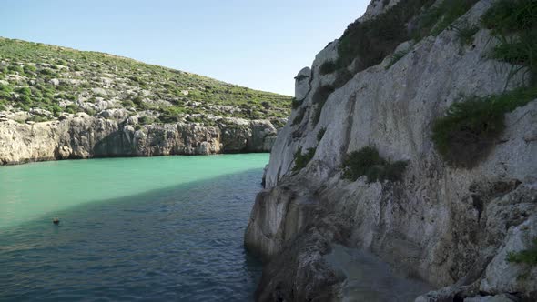 Walking on Magrr Ix-Xini Bay Cliffs near Mediterranean Sea in Gozo Island