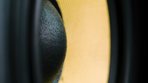 Moving Sub-woofer. Speaker Part. Black and Yellow Colors of Membrane. Concept of Musical