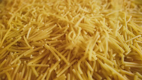 Cornmeal Noodles Falling Into a Pile