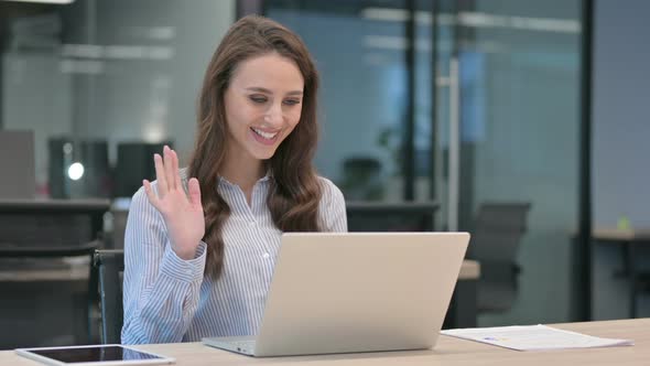 Young Businesswoman Talking on Video Call on Laptop