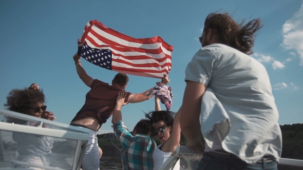 Group of Young People Raise American Flag