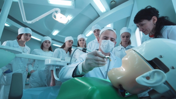 Dentist Giving a Demonstration To Students