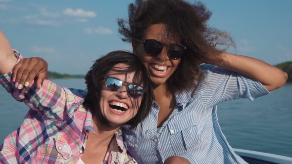 Happy Diverse Girls in Motorboat