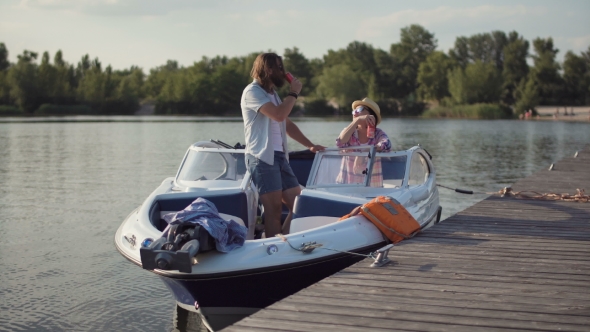 Couple on Boat Having Drinks